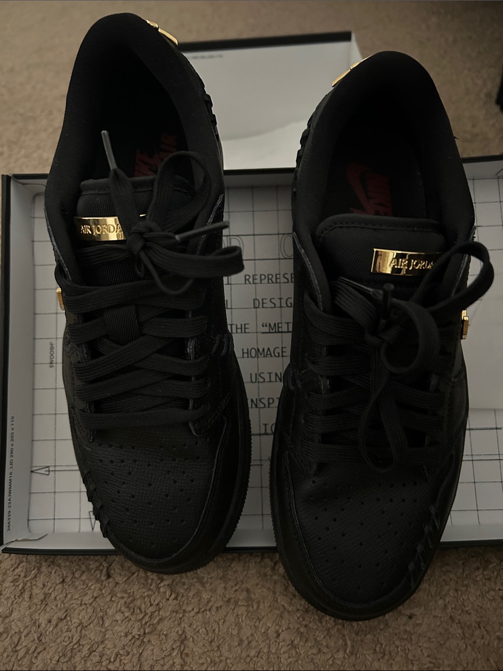 Women’s Jordan Black Low-Top Sneakers with Gold Accents Nike